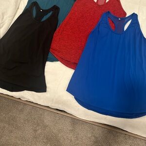 Set of Four Women's Sleeveless workout Tops - Black, Red, Blue, Teal
